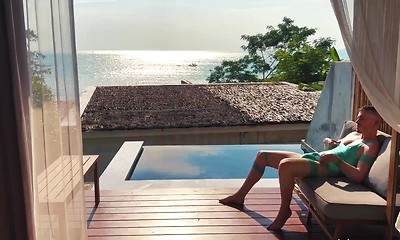 Sea, sex and sun. On a quiet afternoon by the pool, Axel plays...